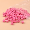 Perle tonde in legno di acero rosa con fori grandi per gioielli fai-da-te in sacchetto - Rosa