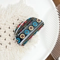 Bohemian polka dot acrylic claw clip with colorful geometric patterns on a white plate - Small Snowflake Black