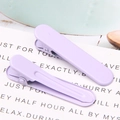 Detail of two lavender purple matte metal duckbill hair clips on decorative paper card - 1.3x4.9cm / Taro Purple
