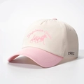 Detail view of the side 1982 embroidery on a pink and beige vintage baseball cap - Adjustable / Off-white and Pink