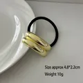 Minimalist elastic hair tie with double gold metallic tubes and black rubber band - Double Smooth Bar Gold