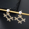 Elegant gold earrings with pearls and zircon geometric bow pendants on dark background - Geometric Frame Style (E01223G)
