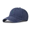 Vista dettagliata del tessuto in cotone blu navy lavato e del ricamo a palma verde - Blu navy