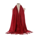 Detail shot of soft solid red cashmere-like scarf with fringe tassels on a mannequin - Wine Red