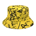 Detail of yellow bucket hat featuring black graffiti letter prints and cotton texture - Yellow