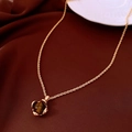 Macro shot of retro golden chain with brown tiger eye stone heart pendant on silk - 16# Gold-Coffee