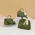 Green leather wedding favor bags with gold hardware and elegant decorative ribbons - Stone Green