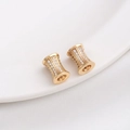 Macro detail of 14K gold plated wheel spacers with micro-paved cubic zirconia accents - Style 16 / 10x7MM / 14K Gold