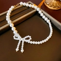 Elegant pearl choker necklace featuring a unique handmade pearl bowknot design with gold clasp - 58# Butterfly Pearl Necklace (10mm Bow)