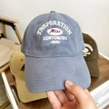 Close-up of white letter embroidery detail on retro cotton baseball cap fabric - 58-65cm / Sky Blue