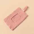 Detailed macro view of the dusty pink cotton crepe fabric texture and button handle - Dusty Pink