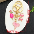 Dettaglio con rosa smaltata rosa, ciondoli XOXO e lecca-lecca a cuore, misure 8cm per 3cm - Stile Cuore Rosa Rosa Smaltato (ER1278)