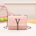 Pink quilted crossbody chain bag featuring a V-shaped metal logo and fringe tassel - Pink
