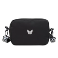 Sac bandoulière minimaliste en nylon noir avec papillon en métal et sangle large - Noir