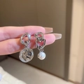 Detail of asymmetric silver chain earrings with portrait coin and faux pearl drop - Silver Needle - Silver Asymmetric Drop Earrings