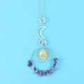 Detail of crystal suncatcher featuring golden moon, sun charm and purple amethyst stones - Purple Crystal