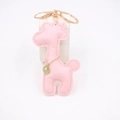 Detail of pink PU leather giraffe keychain with golden metal clasp and charm - Pink
