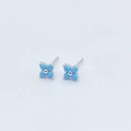 Macro shot of S925 sterling silver four-leaf flower stud earrings with blue turquoise gems - Silver With Turquoise Blue Zirconia