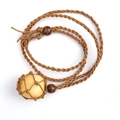 Handmade woven necklace with raw yellow crystal stone pendant in a brown net pouch - Citrine