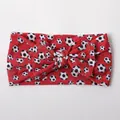 Detail of red baby headband with football print and soft nylon bow design - Red Soccer Pattern