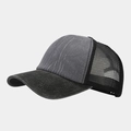 Close-up of grey washed fabric texture and black mesh netting on a trucker cap - Gray