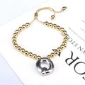 Detail of gold beaded bracelet with silver twisted ring charm and adjustable slider chain - Letter Q