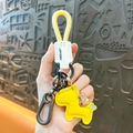 Llavero de caballo de cuero amarillo con cuerda trenzada y colgante de bolsa de dinero. - Amarillo