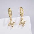 Detailed macro view of gold-tone H-letter earrings with shimmering micro-pave crystals - Letter H (Style: 0229)
