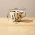 Hand-painted ceramic coffee mug with vintage brown floral pattern and textured finish - Man Grass