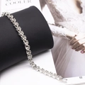 Silver chain bracelet with clear rhinestones draped on black cylinder watch set piece - Silver Bracelet