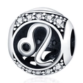 Macro shot of silver Leo zodiac charm with sparkling cubic zirconia for DIY jewelry - Leo