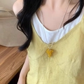 Detail of vintage silver chain necklace featuring yellow beaded grape cluster pendant - Yellow Grape Cluster Style