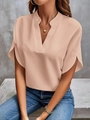 Detail of light pink V-neck chiffon blouse with elegant short raglan sleeves on a model - Pink