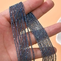 Close-up of 2mm faceted crystal glass beads in blue-purple with rainbow luster for DIY jewelry - Fantasy Blue