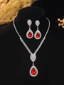 Detail of red teardrop gemstone necklace and earring set on black mannequin display - Retro Teardrop Set / Red