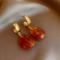Close-up of golden irregular earrings with amber resin marble texture on silk - Irregular Square (8#) / Silver / Brown