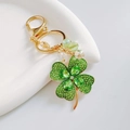 Gold keychain with green crystal lucky four-leaf clover and sparkling rhinestone beads - Green