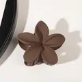 Macro view of matte mocha flower hair claw clip with smooth round petals on plain background - Matte Dark Coffee