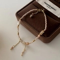 Elegant beaded bracelet with white pearl and natural stone on a brown jewelry box - Pink Series Bracelet SL0136