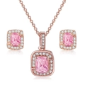 Macro detail of rose gold jewelry set with emerald-cut pink zircon and diamond halo - Rose Gold + Pink Stone Set