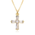 Detailed view of a gold cross pendant necklace featuring cubic zirconia on white mirror surface - Luxury Hollow Rhinestone Style (B241)