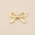 Detailed macro view of 18K gold-plated bow charm with sparkling cubic zirconia inlay - Center Zirconia Bow (PJ0505) / Gold