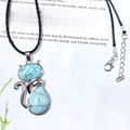 Cat shaped turquoise pendant with silver alloy frame on a black adjustable rope chain - Turquoise
