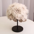 Detailed close-up of beige crochet knit beanie with rabbit fur trim and flower pattern - Beige