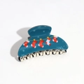 Close-up of a blue semi-circle hair claw clip with festive red Christmas sock patterns - Blue Small Semicircle