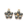 Detailed view of grey enamel cherry blossom charms with gold-plated metal borders - Black