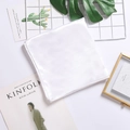 Elegant white square satin silk scarf neatly folded with pearl luster on white background - White