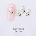 Macro shot of 6x11mm white tulip nail art charms with gold trim on a pink manicure display - White Tulip Gold Base (8512)