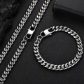 Silver stainless steel Cuban chain necklace and bracelet set on a black textured background - Necklace (20 Inch) / Width 5mm / Steel