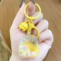 Cute yellow backpack liquid keychain with colorful floating beads and a golden bell - Mini Backpack - Yellow